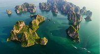 The limestone Islands in Halong look likely the landing dragons