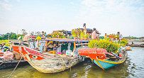 Colorful and bustling Cai Be floating market