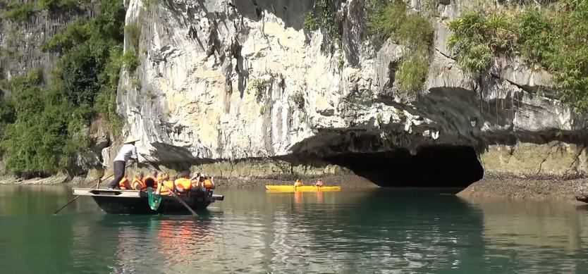 Go kayak among the emerald water of Bright and Dark Cave