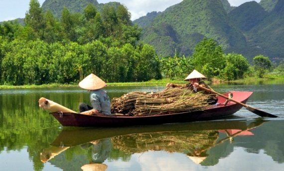 Local rowing boat in Mekong River Vietnam in the trips to Vietnam and Cambodia