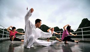 Taking part in Tai Chi Class on sundeck in early morning