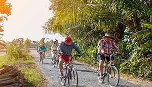 Cycling along the path through village in Thanh Binh village