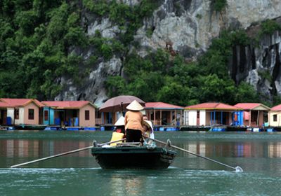 Come over the fishing village by a padded boat of locals in Glance of Vietnam tour 7 days
