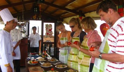Join in cooking class on board to explore Hoian's culture