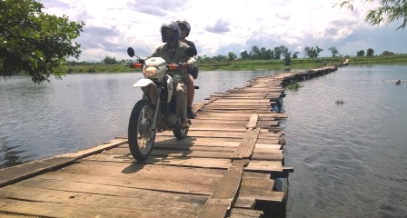 Cross over bamboo bridge with Hoi An Easy Rider Tour