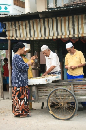 Cham people in Chau Giang with the typical white hat