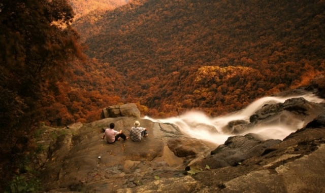 Do Quyen waterfall is in a blazing red below the light of sunset