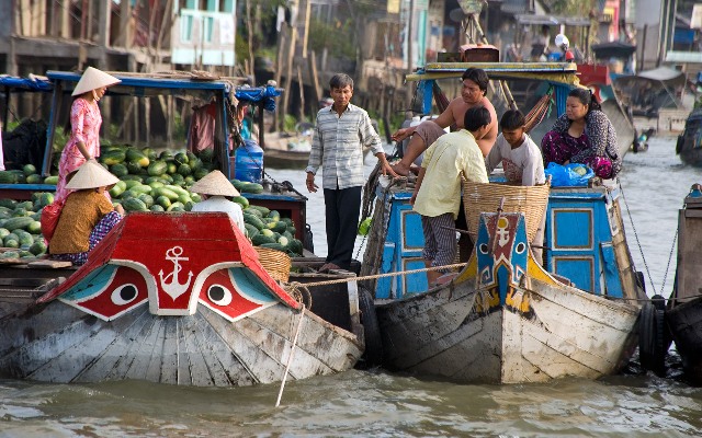 Hundreds of boats rowing into the Mekong River