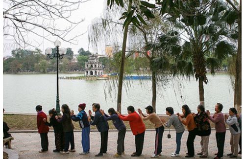A peaceful winter morning of seniors in the area of Hoan Kiem Lake.