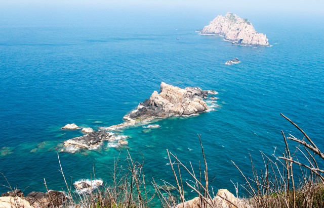 Blue sea water and white sand beach in the beach of Hon Lon