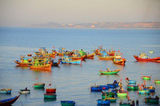 Mui Ne beach with the colorful fishing boats.