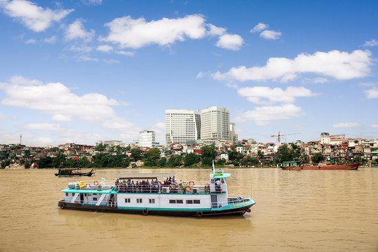 Hopping on a boat sailing on the Red River to explore the area