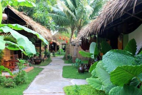 Mekong Delta is often located on the bank of the river and enclosed by the tropical garden.