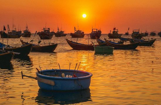 Admiring the sunset in the fishing village is one of the top things to do in Mui Ne.