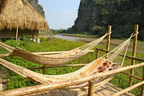 Ninh Binh homestay is rustic, but amazing with the view to natural swamp and limestone rocks.