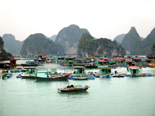 the floating village among the emerald ocean of Halong Bay