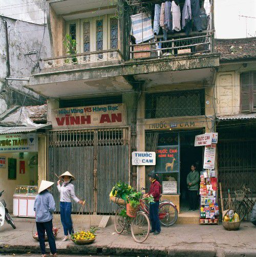 The street vendors with their burdens is considered a typical feature of Hanoi